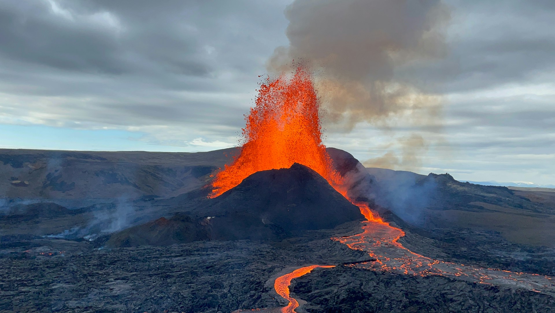 A volcano spewing lava into the sky